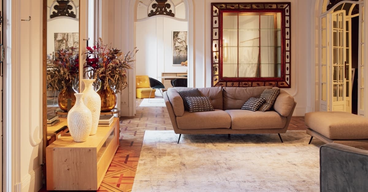 Elegant luxury living room interior with modern sofa, designer décor, warm lighting, and refined European architectural details