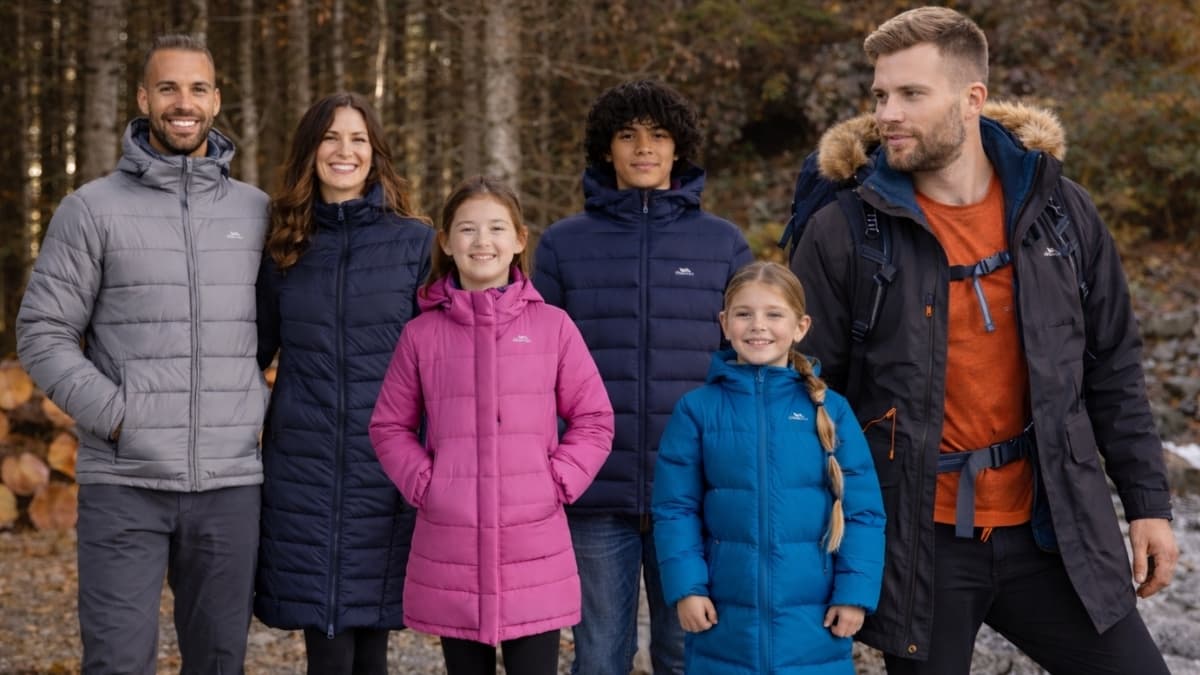 Family wearing Trespass outdoor jackets during fall hike, showcasing Trespass outdoor clothing sale styles