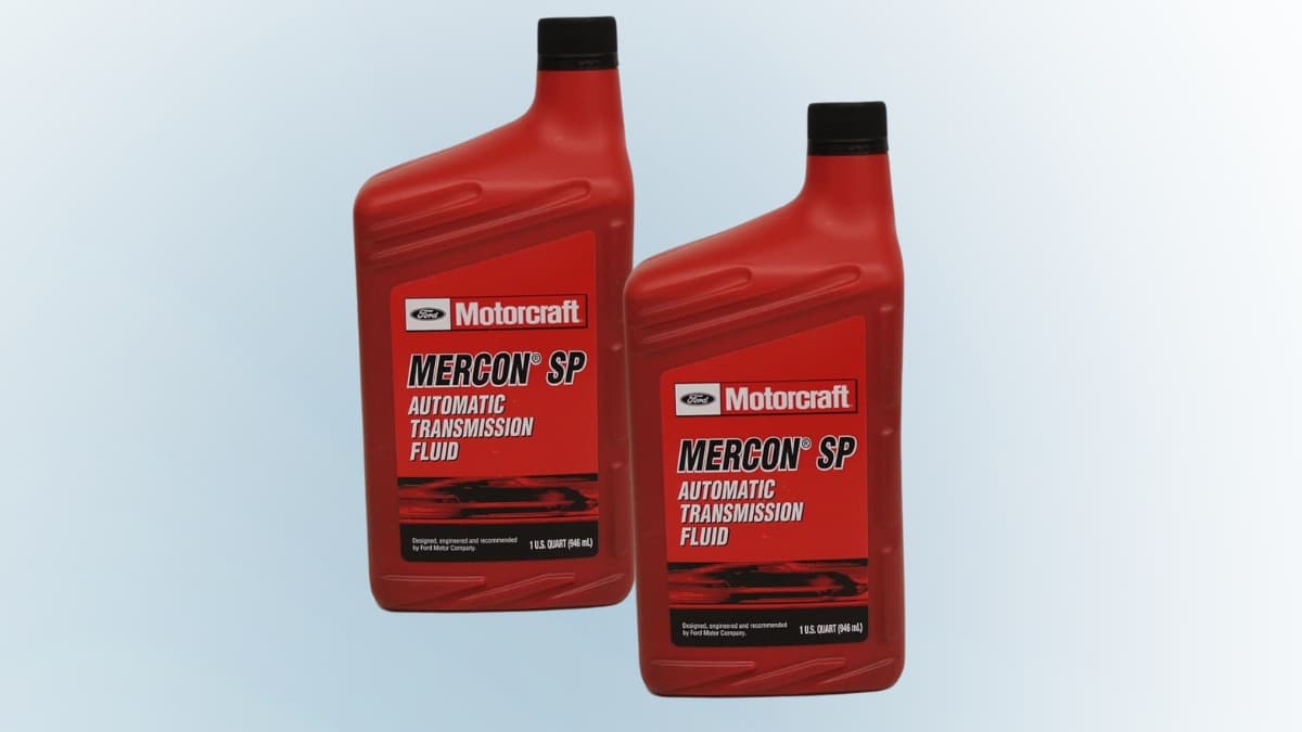 Two bottles of Motorcraft MERCON SP transmission fluid with red labels shown on a light background.