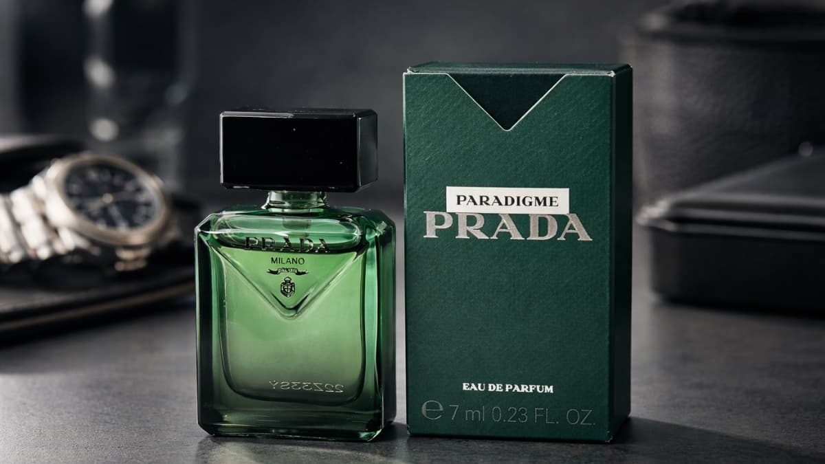 Prada Paradigme EDP for Men green glass bottle with matching box on dark countertop