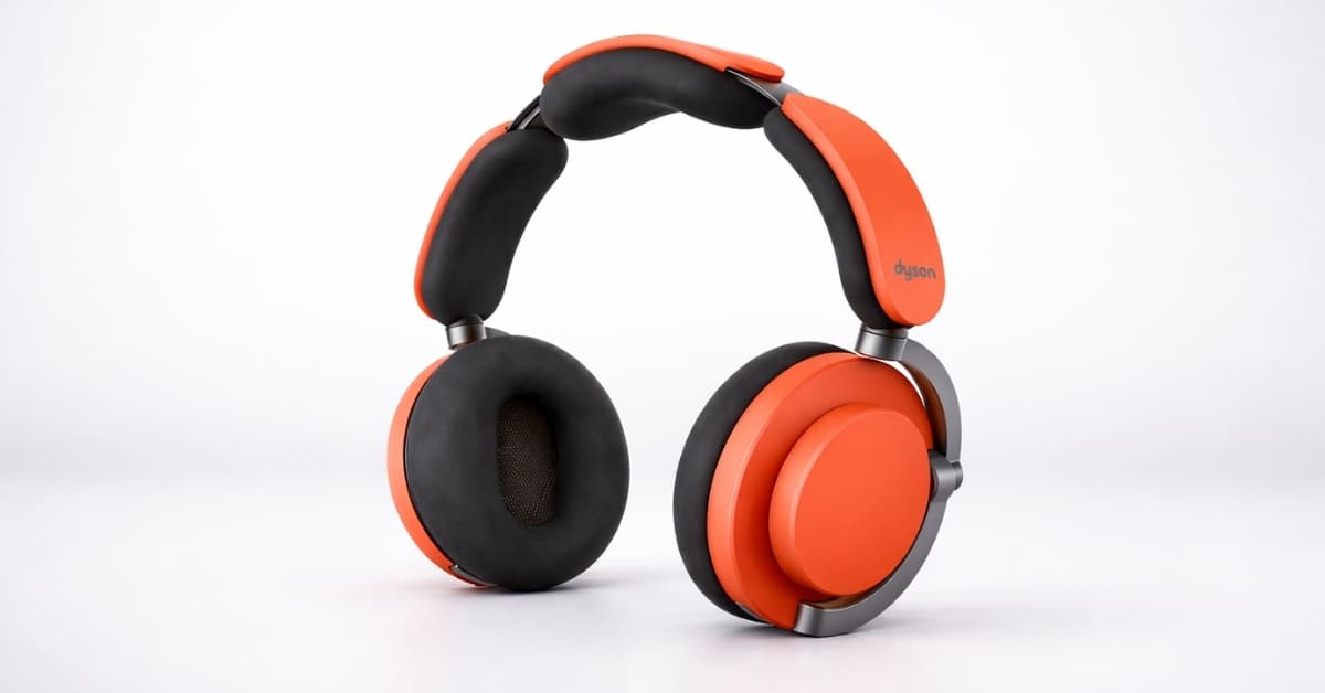 Dyson OnTrac Headphones Ceramic Cinnabar with orange ear cups and cushioned headband on white background