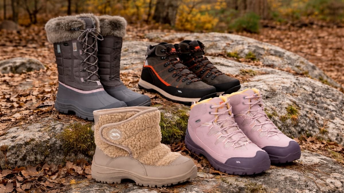 Trespass footwear boots and hiking shoes displayed outdoors on autumn forest rocks